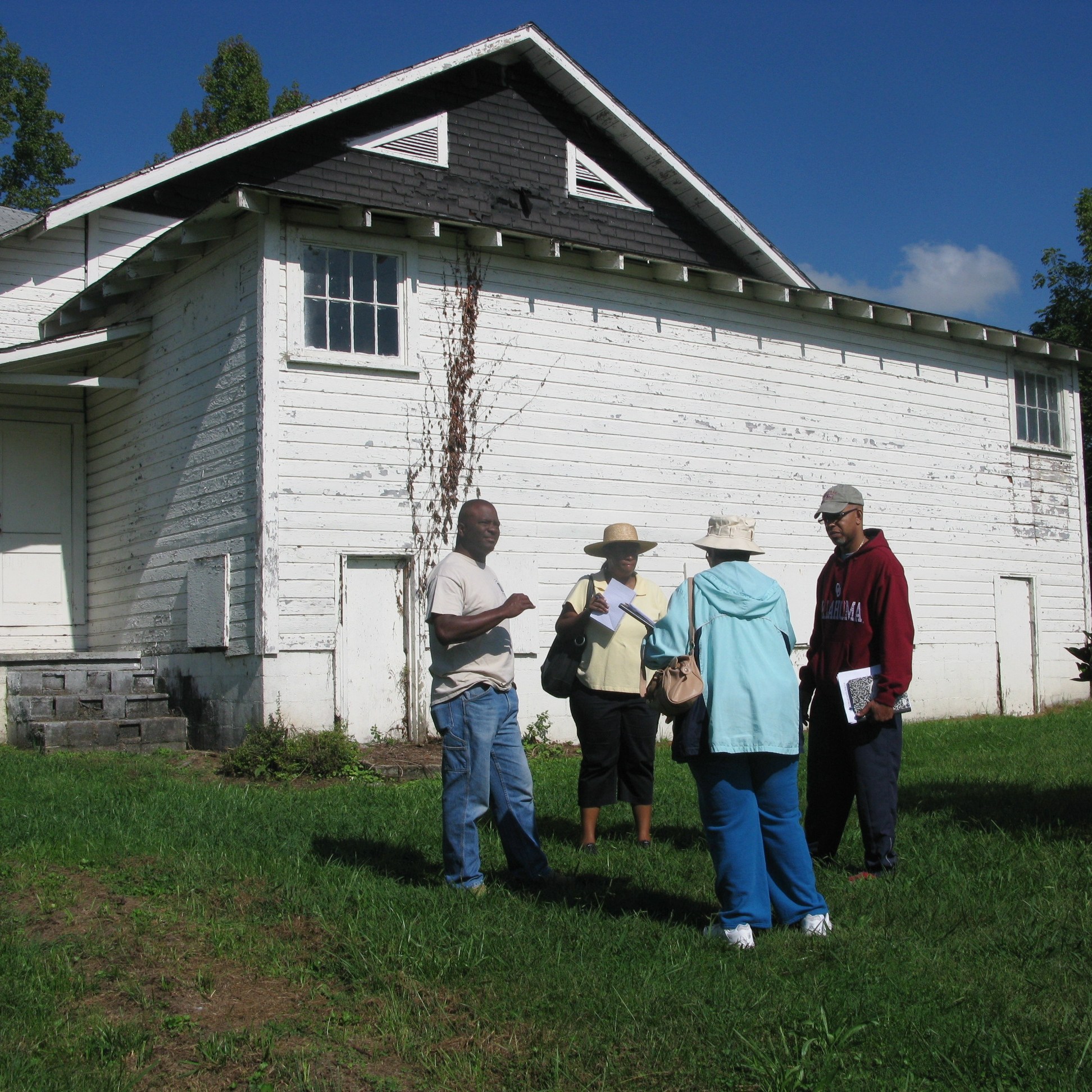 MCJCC board members in front of the "old" community center (from left to right, Randy Lytle, Karen Darity, Edith Darity, Lewis Whiteside, Jr